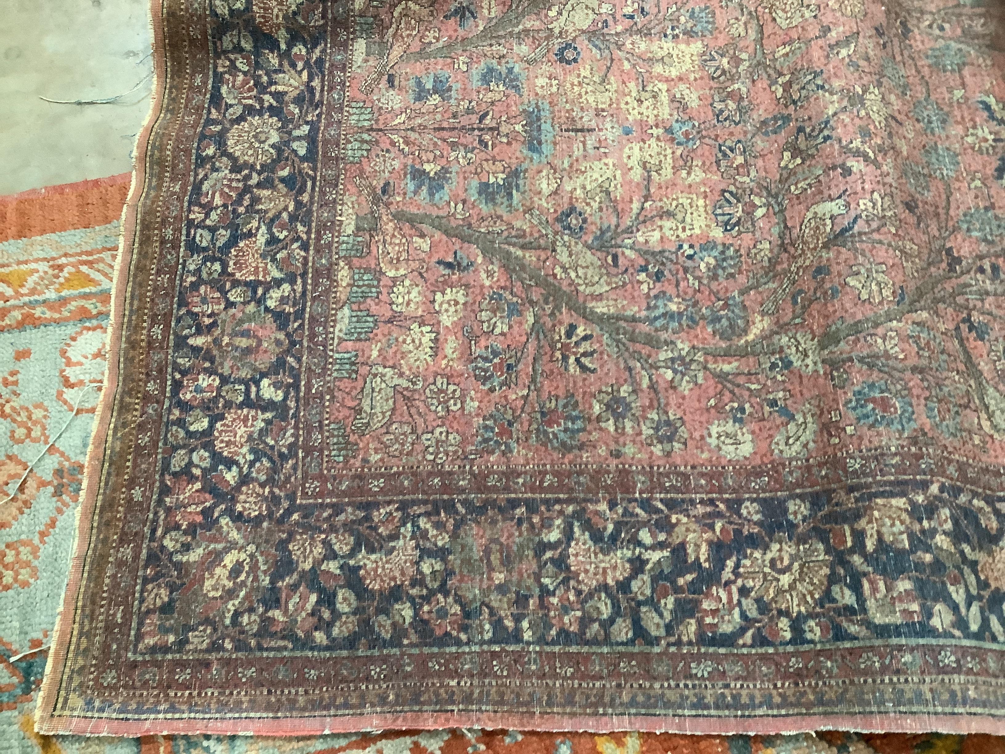 A Tabriz peach ground 'Tree of Life' rug, 194 x 126cm